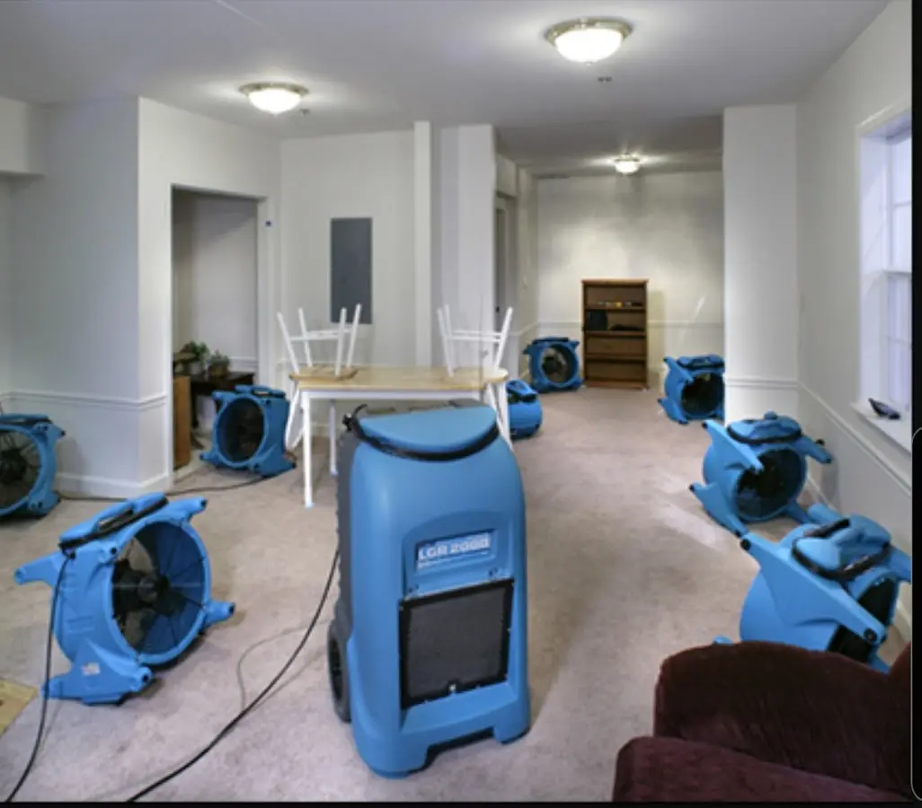 Air movers and dehumidifier setup for Water Damage Restoration in Oswego